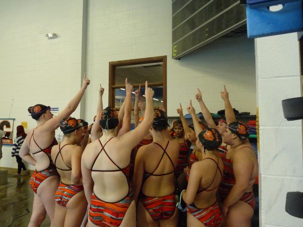 The Swimmin Women do their chant before their meet at Olympic High School.