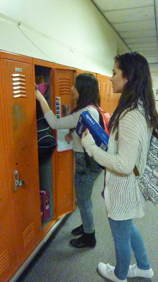 Sidney Arnold chats with Leanna Naji as they organize her locker. Leanna Naji said, “I try to keep my locker as organized as possible so that it’s easier to find my books for class.” Both girls are trying to keep their lockers organized so that they don’t get any school supplies mixed up with their locker partners’.