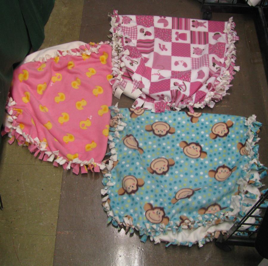 The club plans on making a total of thirteen baby blankets similar to the three featured above.
