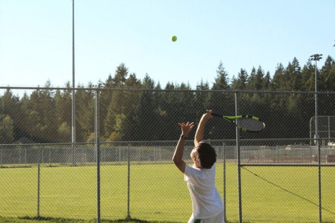 Woon Na serves to start off his first match of the season.