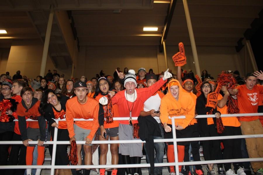 A huge group of fans in the stands giving our football team lots of support!