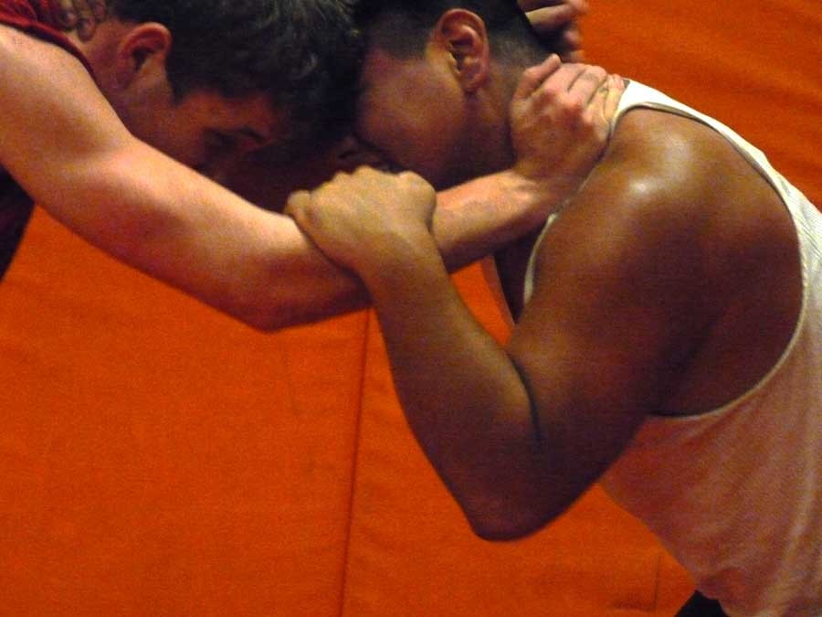Locked together, Valenzuela and TJ (from Klahowya) battle for control of the mat.