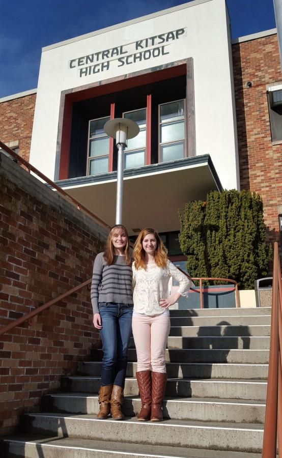 Joy Clark, right, and Madison Largey, left, pose in front of the school.