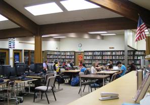Students work in the current CKMS library. 