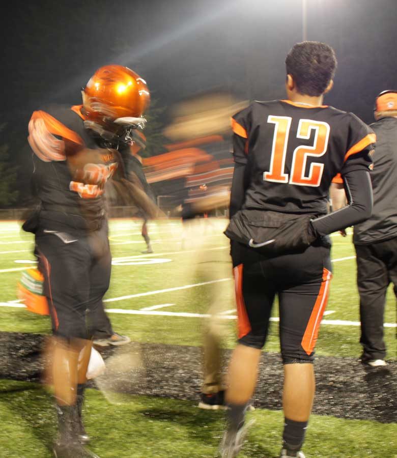 Third string quarterback Christian Arcangel-Diego watched the game against Gig Harbor. 
