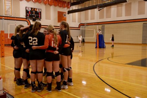 "Cougars on Three" After dominating the Seahawks in the second set, the Cougars gather for a huddle and celebrate their victory and teamwork so far. 