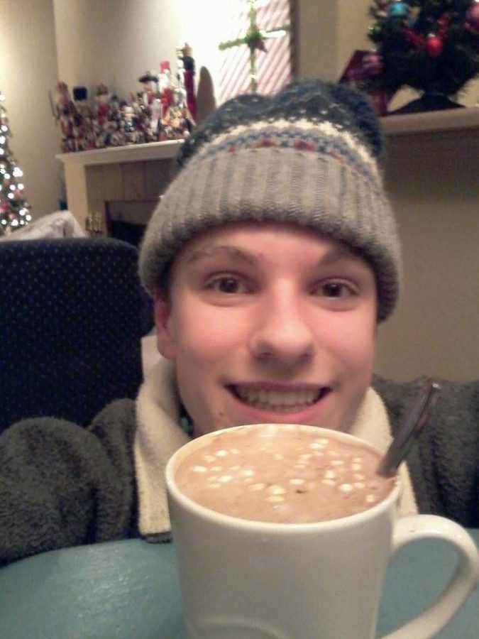 Junior Daniel Lavoie enjoying hot cocoa as he warms up inside from playing in the snow outside. Lavoie was so excited about the snow that he broadcasted a live-stream on Thursday night on Facebook.