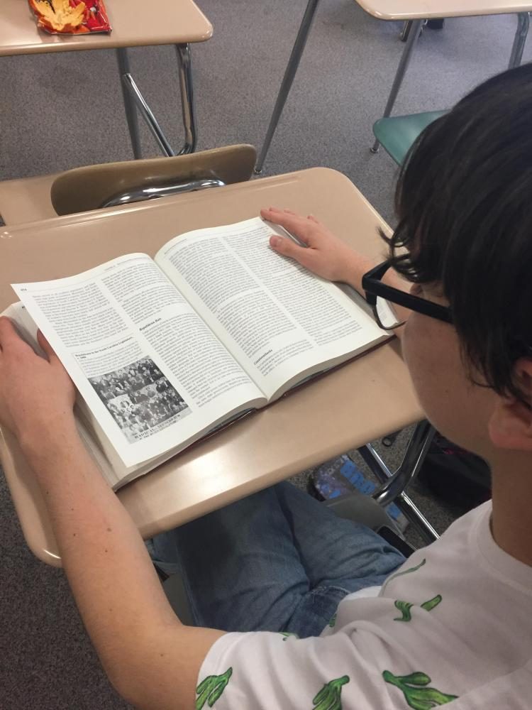 Junior Ronan Spannuth prepares for his AP United States History Exam by re-reading vital chapter summaries in the textbook. 