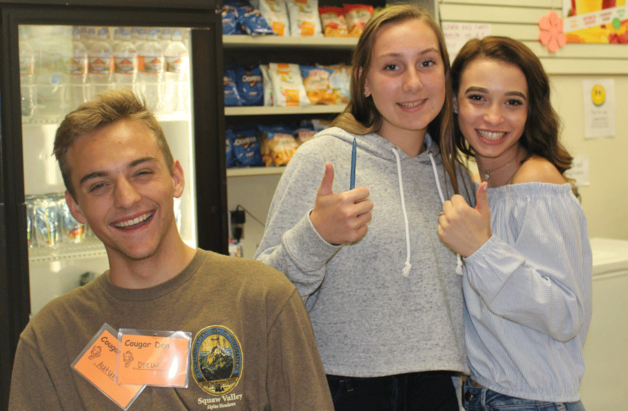 11th grader DECA members working hard in the Cougar Den (Autumn Mullins, Ariana Shindell, Drew Diefendorf)