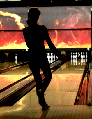A bowler moments away from a strike.