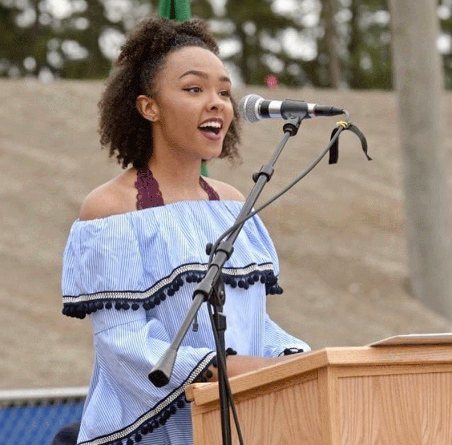 Ania Briggs speaking at the ground breaking of the new school.