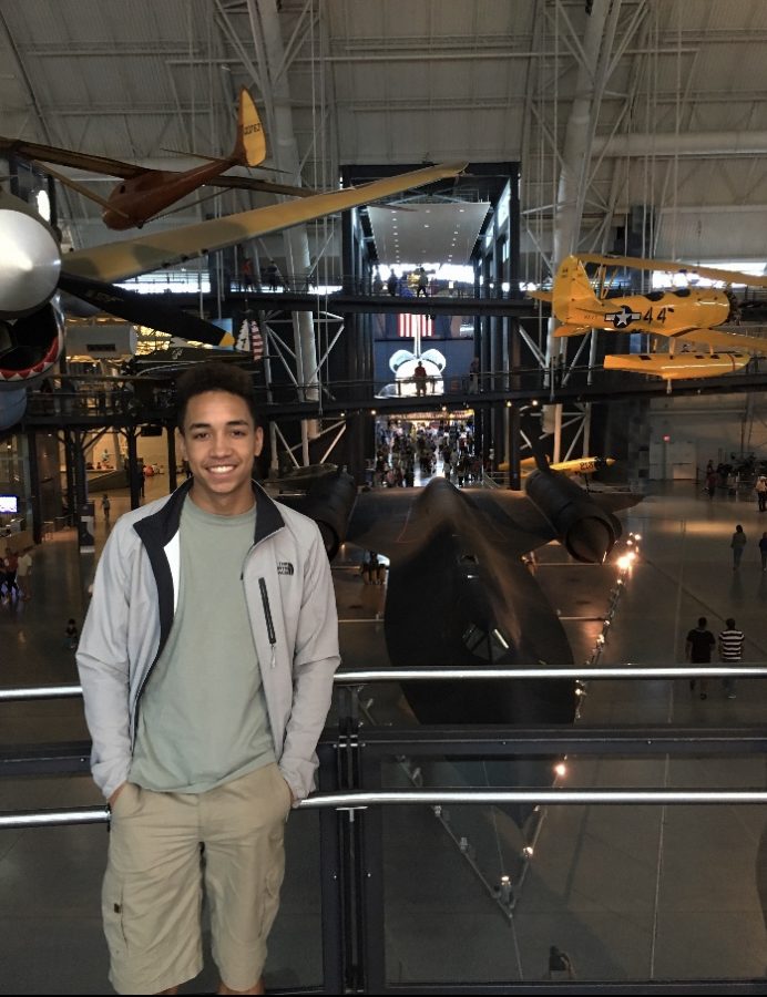 Julian standing in front of a stealth plane.