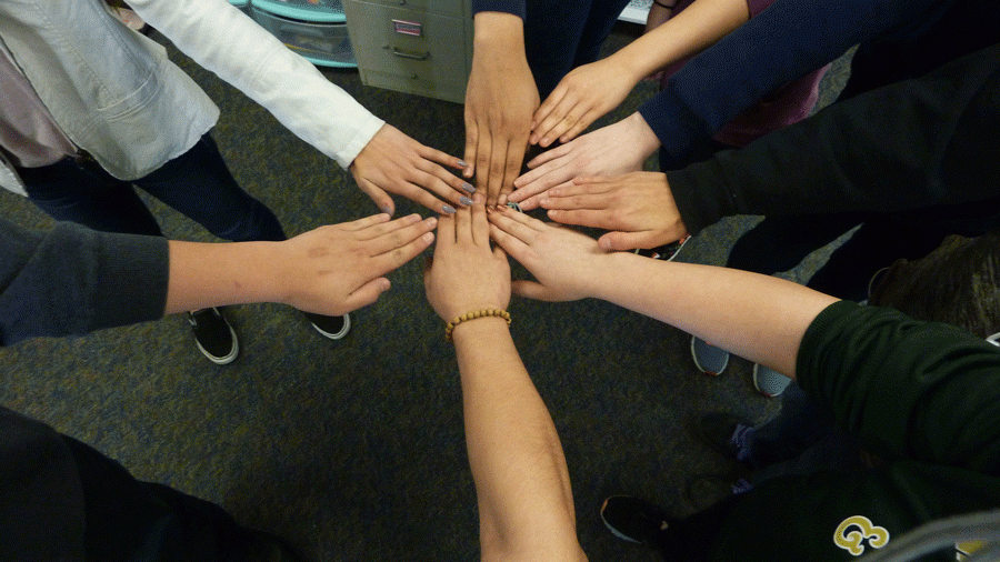 Students hands that represent the diversity of our school.