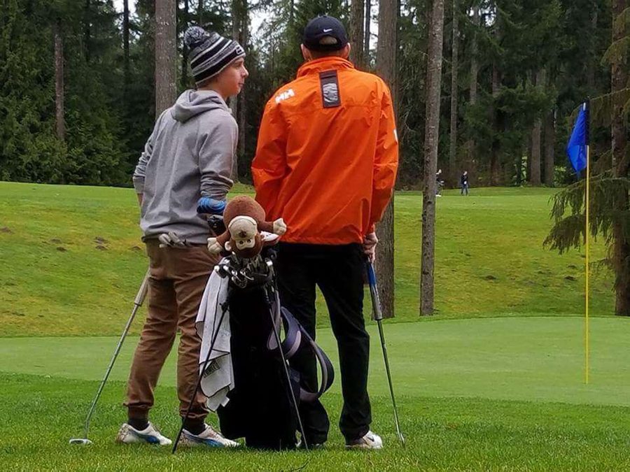 Senior Logan Jacobson and a player from Bremerton High School at a match at Gold Mountain. 