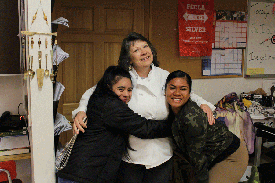 Ms. Schick hugging her students Althea and Elasa

