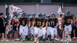 The Cougars are taking the field ready to take down their opponent.