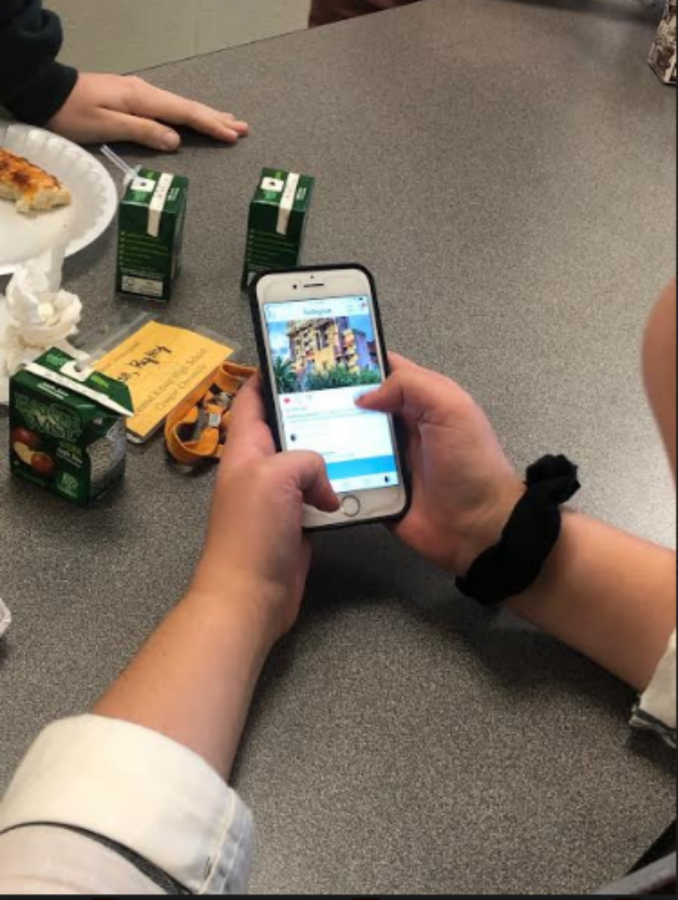 A student scrolling through instagram at her lunch period.