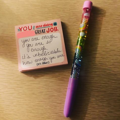 Sticky notes and a glittery rainbow pen
