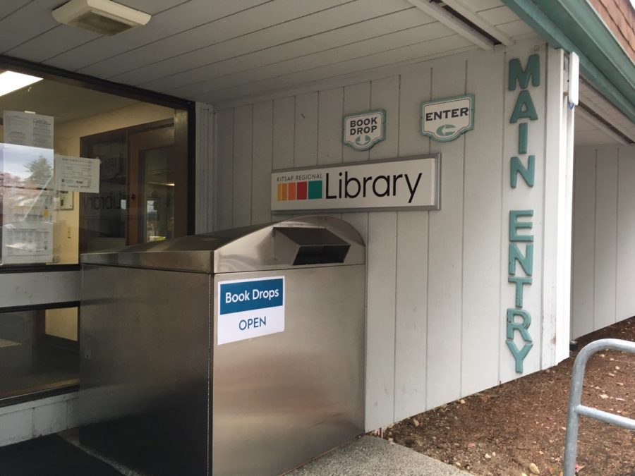 The main entrance to the Silverdale Branch of the  Kitsap Regional Library still has active book and audio/visual drop boxes for patrons to return books; after theyve been returned, they are quarantined for 72 hours. 