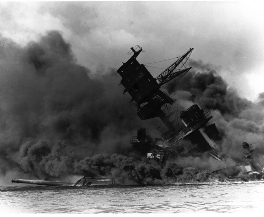 A US battleship, the USS Arizona, goes down after collapse of her forward magazines. 