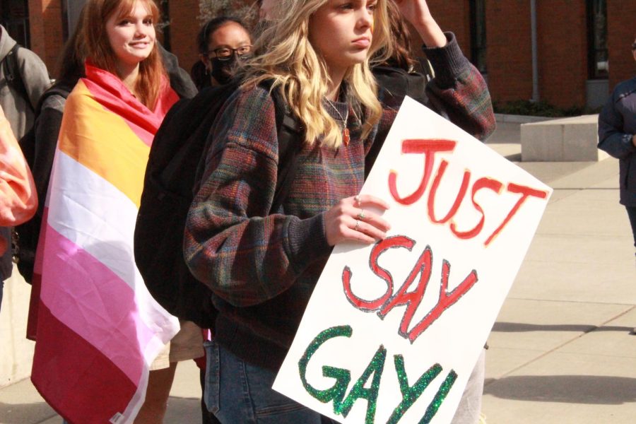 Student holds poster saying Just say gay! 