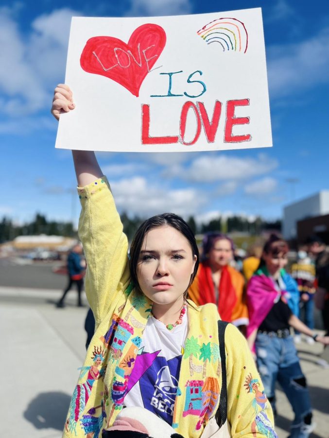 A protester holding up a sign at the nation LGBTQ+ Rights Walkout held on April 1, 2022. 