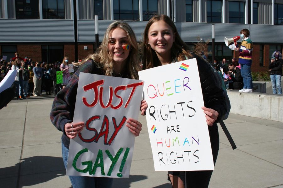 Students holding signs against the Dont Say Gay bill at the walkout. 