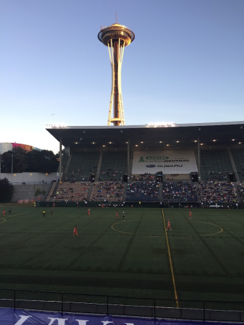 The sun sets on the Space Needle sitting behind Memorial Stadium, 2018.