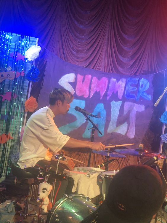 Eugene Chung playing the drums during their Summer tour
