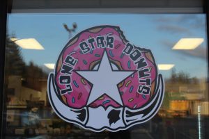 Lone Star Donuts window logo.