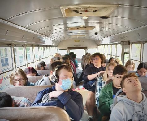 Students sitting down ready to go home.