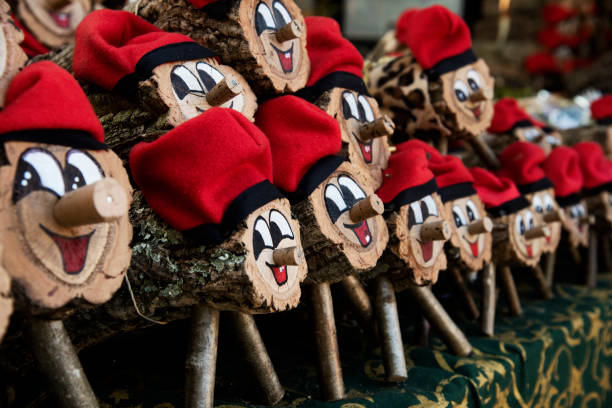 Some handcrafted Caga Tio Logs being sold at a Christmas market