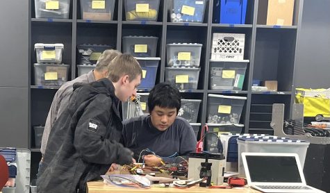 Club members Sam and Axel Learning Electrical boards