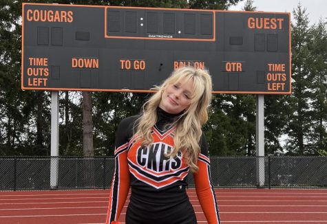 Haley Robinson posing on the CKHS football field for senior year cheer pictures. (Courtesy of Kelly Jo Robinson)