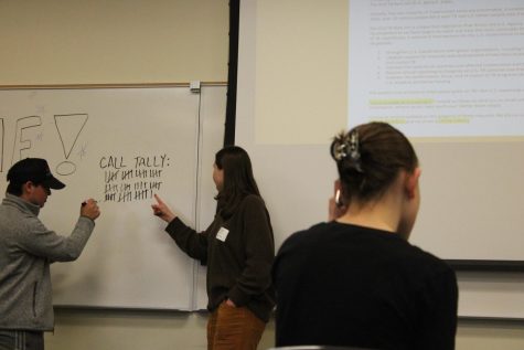 Students calling members of Congress to encourage them to expand health access. A tally mark of total calls can be seen in the background.
