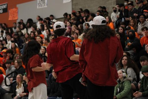 Lauren Heidt (right), Abi Lundblad (center), and Hani Mai Elopre Thesenga (left) dance in front of the sophmore section of the crowd 
