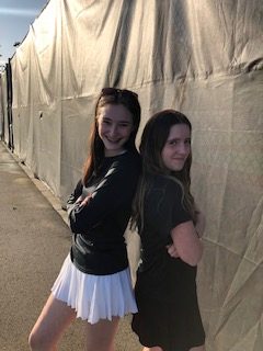 Charlotte Willer and Olivia Jenson posing after finishing a tennis match