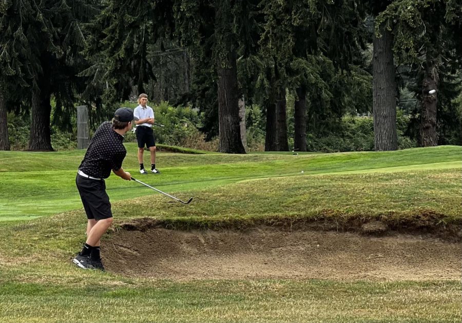 Spencer Harader hitting out of the bunker at the Kitsap Golf and Country Club. (Courtesy of Kelly Harader) 