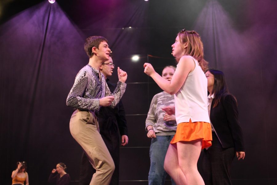 Miles Borer and Lillian Johnson dance and sing during mic checks prior to the performance. (Rosalie Johnson)