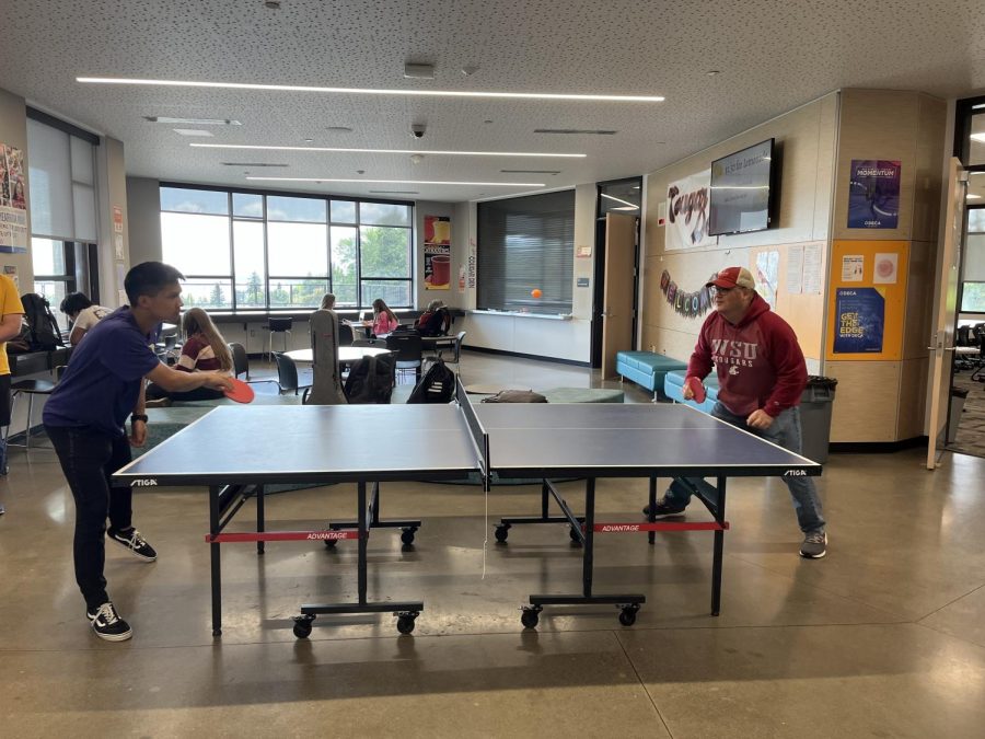 Student+Kai+Boydon+and+Staff+Tyler+Hunt+playing+a+game+Ping+pong