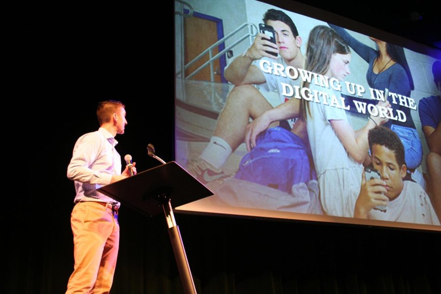 Dan Finan in front of slide at the beginning of his presentation regarding social media safety.