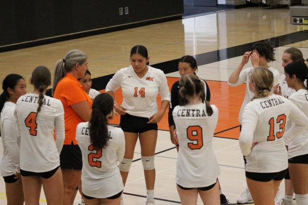 Coach Arthur talks to her team during a timeout.