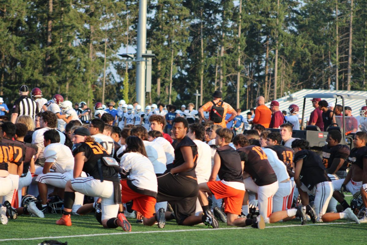 CKHS huddles at the center of the field after the jamboree.