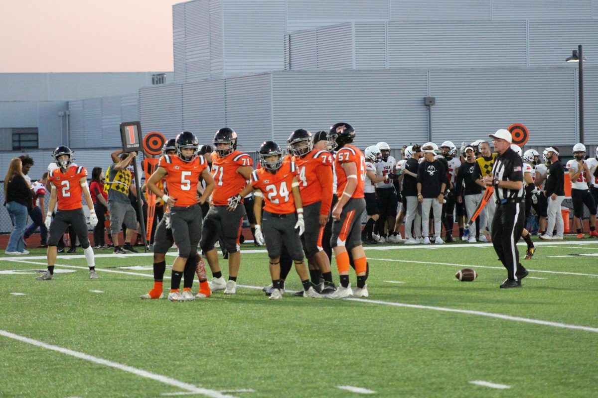 CK football team prepares to take on the next play of their drive.
