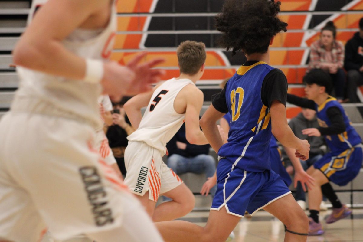 Central Kitsap running the ball after receiving it in a play.