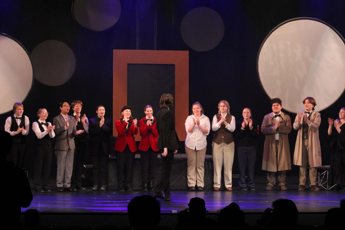Maison Petersen, actor of Dorian Gray, looks back at his fellow cast members as they take their curtain call bow.