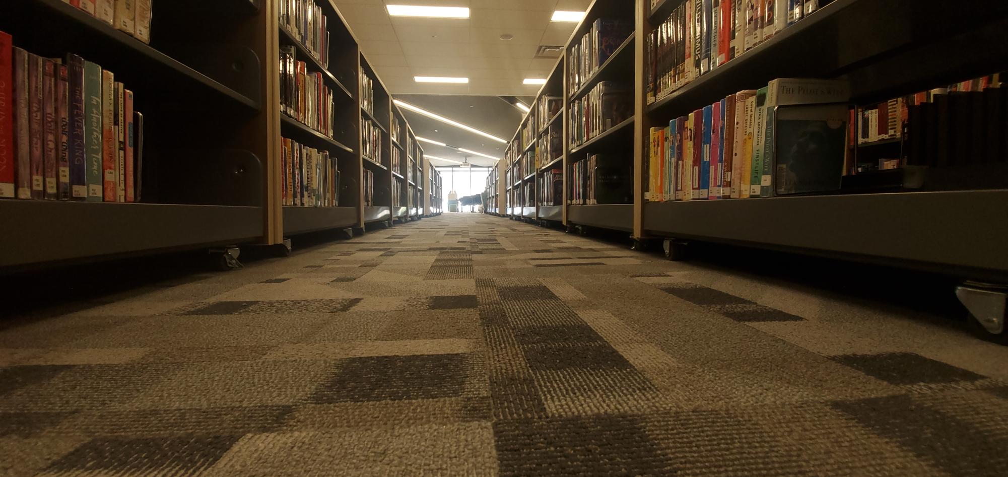 Photo of Central Kitsap High School bookshelf isle in library.