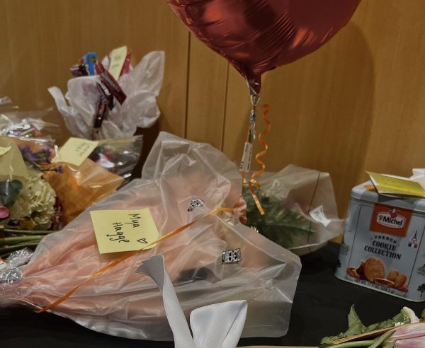 Loved ones leave flower bouquets, balloons, treats, and other gifts to celebrate the performers after the show.