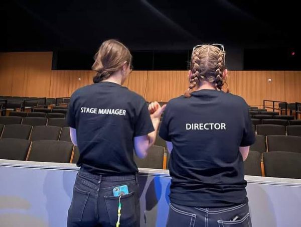 Zee Lee stands on the right in their director t-shirt, accompanied by CK Dramas stage manager on the left. (Provided by Zee Lee).
