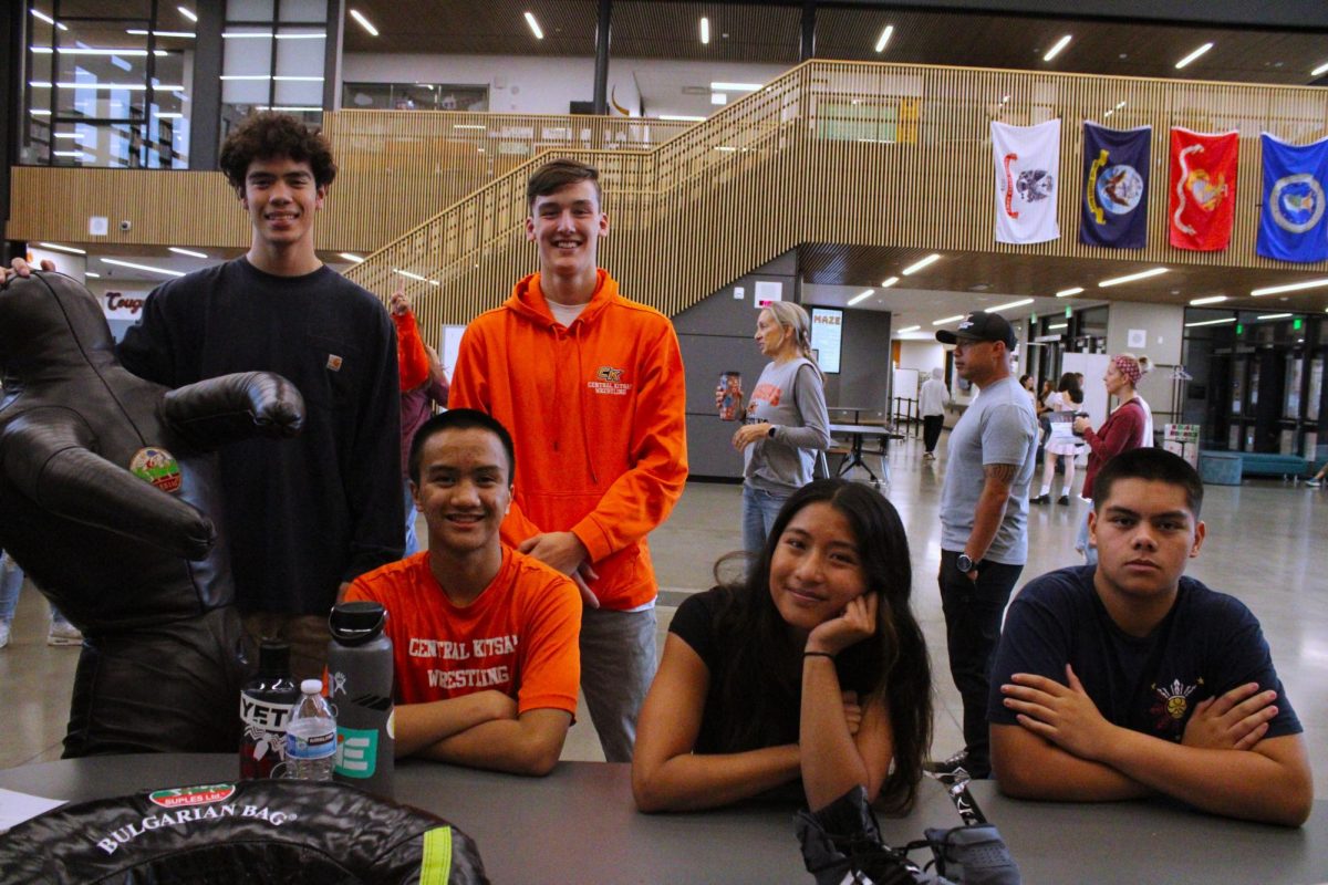 CKHS Wrestling members (left to right) Curtis Schaefer, Keane Sager, Tristyn Nelson, Deijah Diego, and Andrew Cronin all grouped together at their table